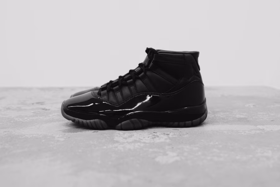Černá a bílá kožená obuv Air Jordan 11 od Comme des Garçons Homme Plus